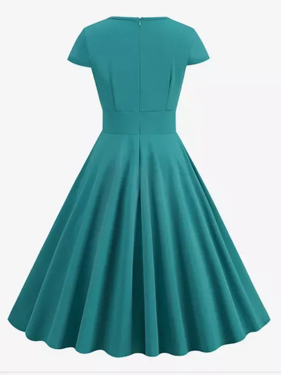 Robe glamour vintage style années 50 col rond manches courtes découpées coupe trapèze moyenne