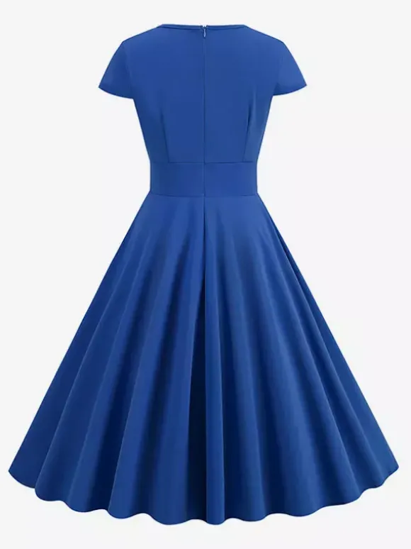 Robe glamour vintage style années 50 col rond manches courtes découpées coupe trapèze moyenne