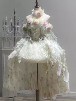 Robe Lolita féerique ornée de fleurs blanches de n艙uds et de volants.