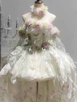 Robe Lolita féerique ornée de fleurs blanches de n艙uds et de volants.