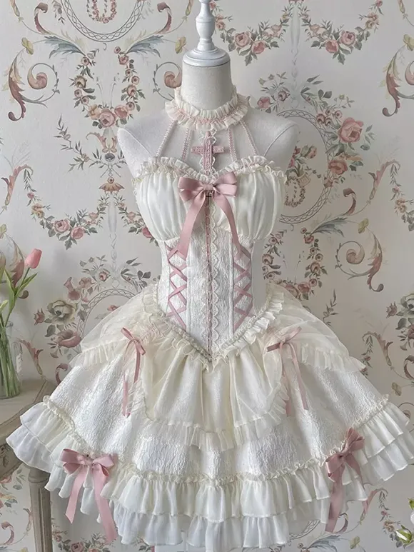 Robe Lolita rose à bretelles sans manches à volants et lacets avec coiffe assortie.
