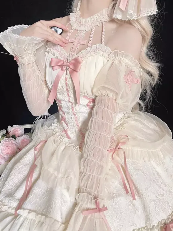 Robe Lolita rose à bretelles sans manches à volants et lacets avec coiffe assortie.