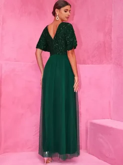 Robe longue de soirée vert foncé à paillettes et fente haute pour soirées 2026