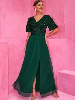 Robe longue de soirée vert foncé à paillettes et fente haute pour soirées 2026