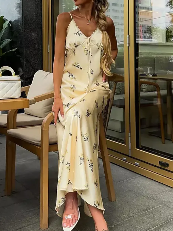 Robe longue d'été chic abricot sans manches dos nu bretelles et décolleté.