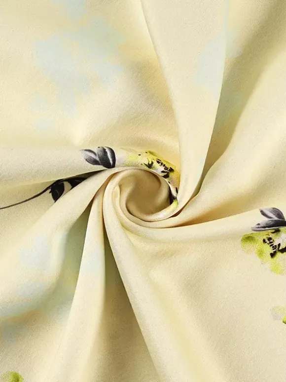Robe longue d'été chic abricot sans manches dos nu bretelles et décolleté.
