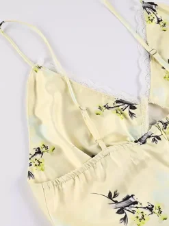 Robe longue d'été chic abricot sans manches dos nu bretelles et décolleté.