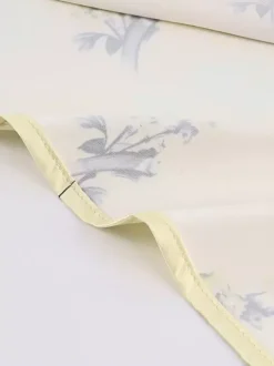 Robe longue d'été chic abricot sans manches dos nu bretelles et décolleté.