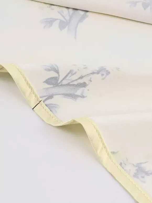 Robe longue d'été chic abricot sans manches dos nu bretelles et décolleté.