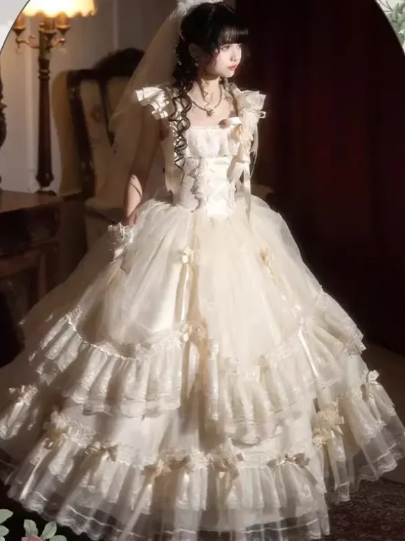 Robe longue Lolita fée blanche à lacets et n艙uds ornée de fleurs idéale pour un goûter.
