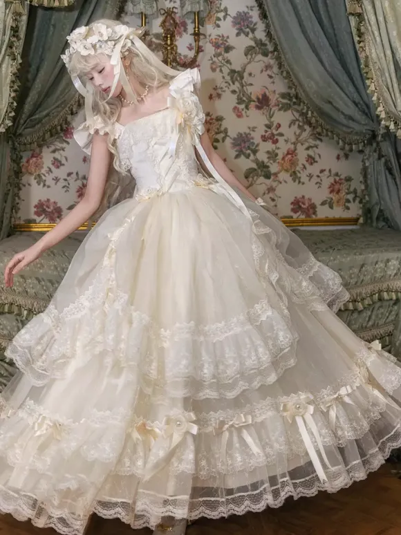 Robe longue Lolita fée blanche à lacets et n艙uds ornée de fleurs idéale pour un goûter.