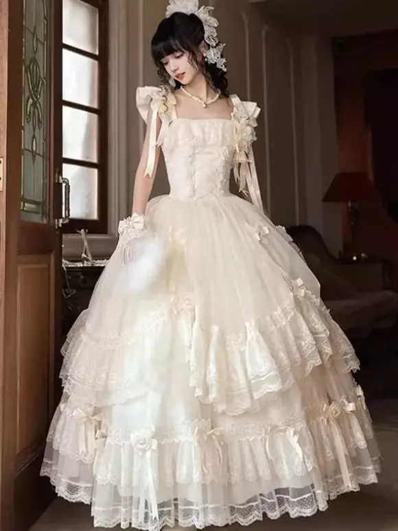 Robe longue Lolita fée blanche à lacets et n艙uds ornée de fleurs idéale pour un goûter.