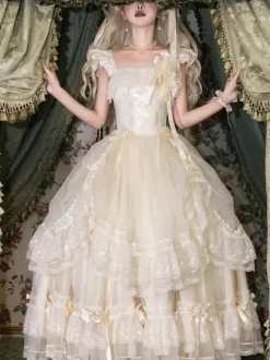 Robe longue Lolita fée blanche à lacets et n艙uds ornée de fleurs idéale pour un goûter.
