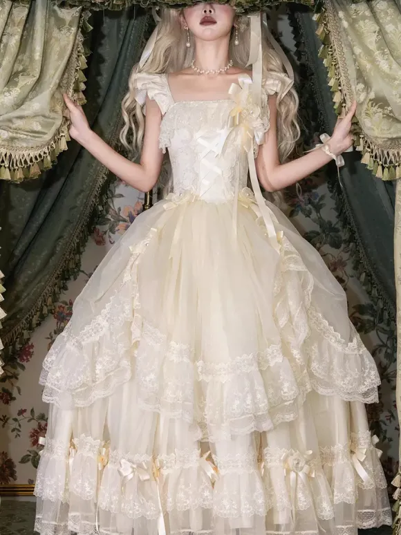 Robe longue Lolita fée blanche à lacets et n艙uds ornée de fleurs idéale pour un goûter.