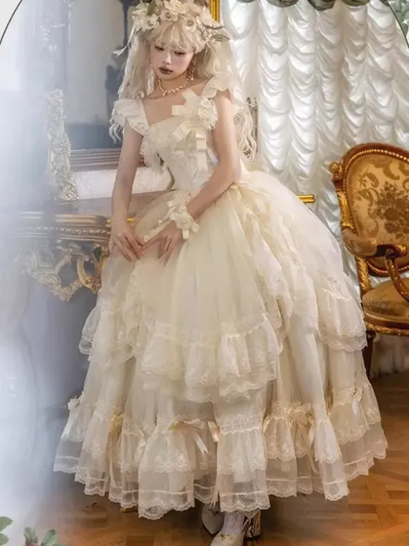 Robe longue Lolita fée blanche à lacets et n艙uds ornée de fleurs idéale pour un goûter.