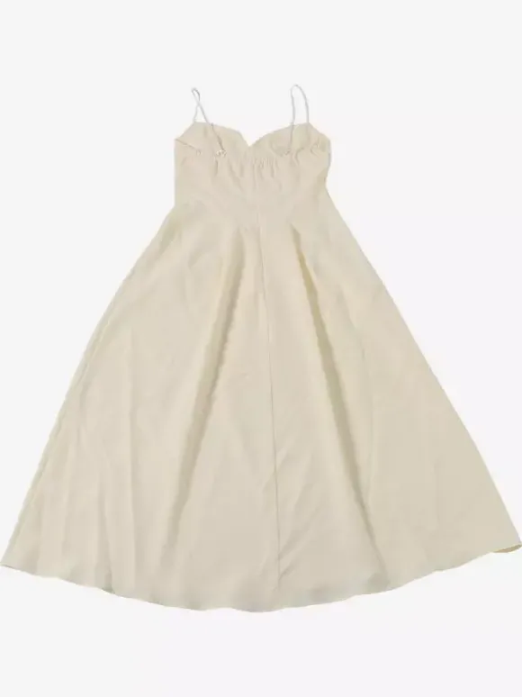 Robe maxi sans manches à bretelles col montant taille haute dos nu plissée couleur abricot.
