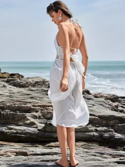 Robe mi-longue blanche cache-c艙ur à col licou pour la plage d'été 2026