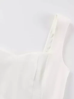 Robe mini blanche sans manches coupe trapèze évasée collection femme 2026