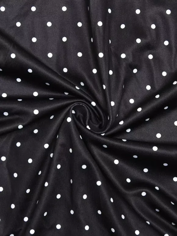 Robe noire cintrée et élégante à pois parfaite pour les sorties décontractées.