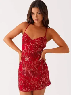 Robe orange cintrée et élégante ornée de sequins floraux parfaite pour les fêtes