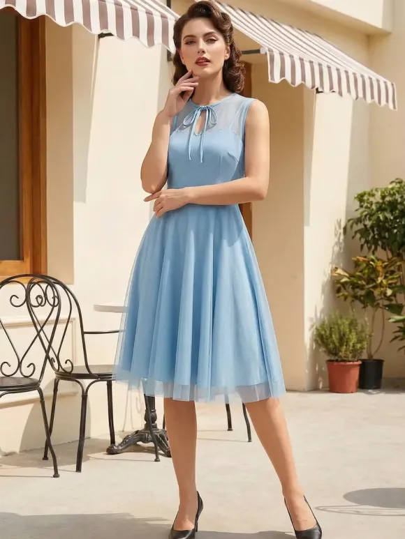 Robe rétro bordeaux transparente style années 50 sans manches col rond coupe rockabilly longueur moyenne.
