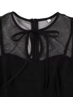 Robe rétro bordeaux transparente style années 50 sans manches col rond coupe rockabilly longueur moyenne.