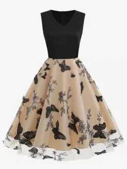 Robe rétro glamour années 50 noire bicolore à volants brodée sans manches col en V style rockabilly