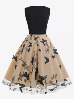 Robe rétro glamour années 50 noire bicolore à volants brodée sans manches col en V style rockabilly