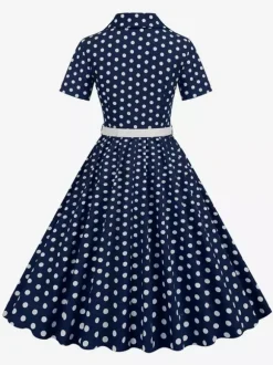 Robe rétro glamour style années 50 col rabattu boutons manches courtes robe trapèze à pois