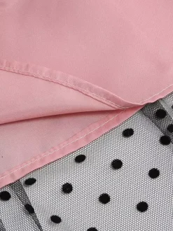 Robe rétro glamour style années 50 col rond manches courtes superposées taille moyenne à pois style rockabilly
