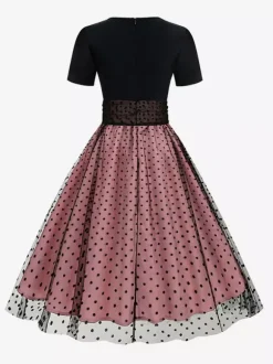 Robe rétro glamour style années 50 col rond manches courtes superposées taille moyenne à pois style rockabilly