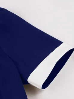 Robe rétro trapèze à col à revers contrasté et double poche pour femme (collection 2026)