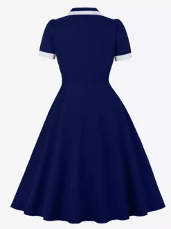 Robe rétro trapèze à col à revers contrasté et double poche pour femme (collection 2026)