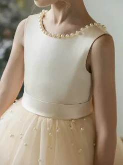 Robes de demoiselle d'honneur de mariage Robes d'occasion spéciale Champagne Perles sans manches