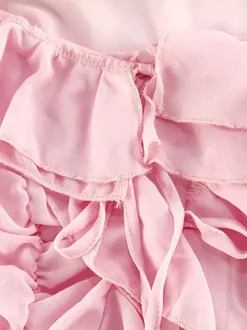 Robes de vacances roses chics mini dos nu à volants manches longues et épaules dénudées