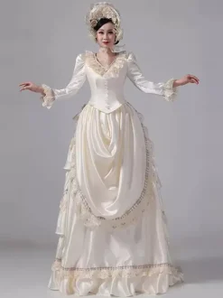 Robe victorienne champagne à tournure manches longues en dentelle à volants et manches évasées style rétro avec chapeau.