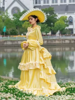Robe victorienne à tournure jaune pour femme style cottagecore vintage manches longues en polyester volants et dentelle.