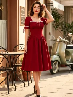 Robe vintage pour femme manches bouffantes coupe midi col carré n艙ud sur le devant évasée.