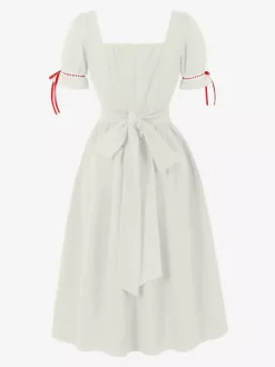 Robe vintage pour femme manches bouffantes coupe midi col carré n艙ud sur le devant évasée.
