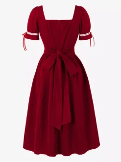 Robe vintage pour femme manches bouffantes coupe midi col carré n艙ud sur le devant évasée.