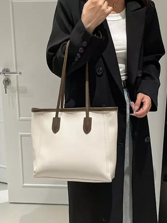 Sac cabas minimaliste en cuir à blocs de couleur grande capacité idéal pour les trajets quotidiens. Sac à bandoulière.