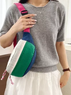 Sac banane léger en nylon color block bandoulière réglable idéal pour les voyages en extérieur.