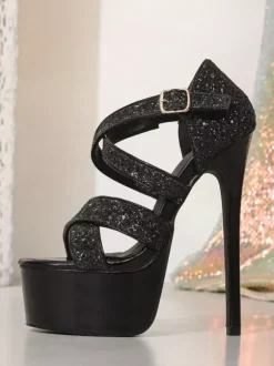 Sandales noires sexy à plateforme pailletée et talons hauts à brides bout ouvert.