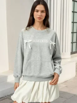 Sweat-shirt oversize à col rond et n艙ud en dentelle poche kangourou manches longues