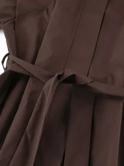 Trench-coat ceinturé pour femme - Col montant chic épaulettes coupe ajustée et péplum - Collection streetwear printemps 2026 au luxe discret