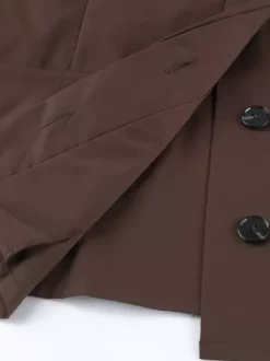 Trench-coat ceinturé pour femme - Col montant chic épaulettes coupe ajustée et péplum - Collection streetwear printemps 2026 au luxe discret