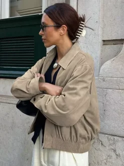 Veste bomber courte décontractée en faux daim pour femme col à revers zippé ourlet côtelé élastique.